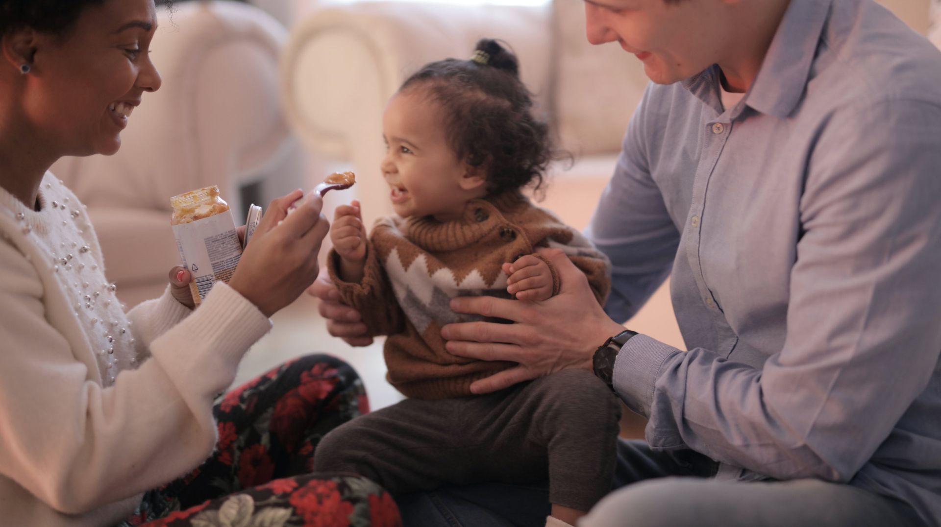 Photo of Woman Feeding Her Child